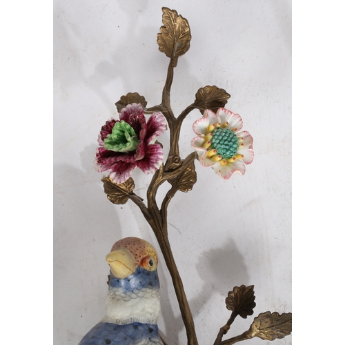 83 - Pair of Meissen style porcelain and gilt metal mounted wall sconce, both with modeled birds of parad... 