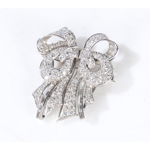 22 - A diamond set double clip brooch, each clip set with brilliant and baguette cut diamonds, with hinge... 