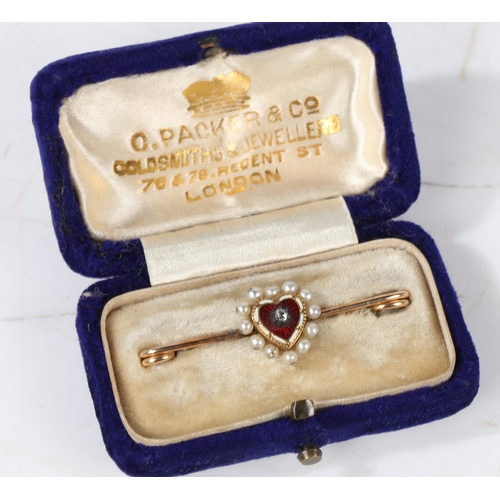 27 - A 15 carat gold bar brooch, the central red and white enamelled heart with diamond to the centre sur... 