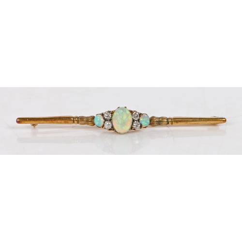 54 - An 18 carat gold bar brooch set with a central oval opal flanked by four diamonds and a further two ... 