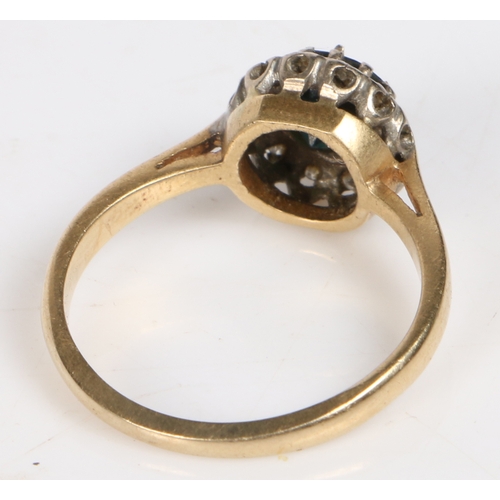 63 - An 18 carat gold, sapphire and diamond ring, the central circular facet cut sapphire surrounded by a... 