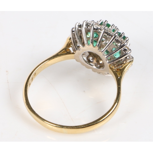 65 - An 18 carat gold, emerald and diamond cluster ring, set with a central diamond surrounded by a band ... 