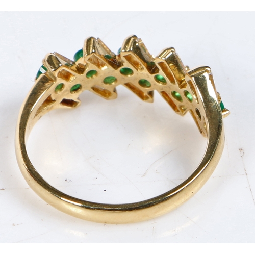 66 - An 18 carat gold, emerald and diamond ring, with ten round cut emeralds mounted in pairs and flanked... 