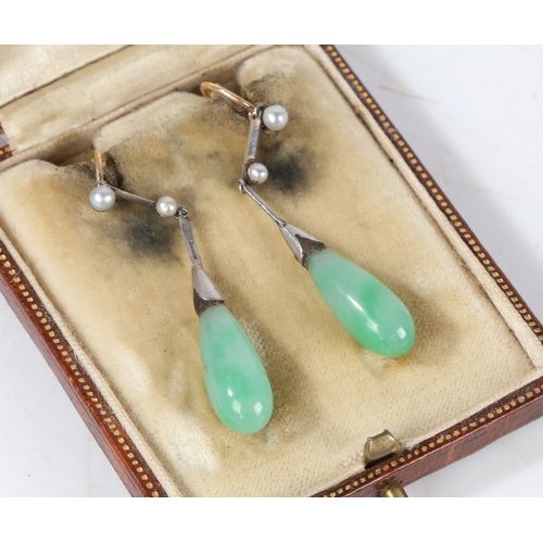 70 - A pair of platinum, jade and pearl earrings, the teardrop form jade drops above pearl set stems, 43m... 