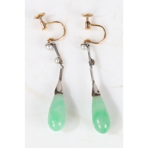 70 - A pair of platinum, jade and pearl earrings, the teardrop form jade drops above pearl set stems, 43m... 