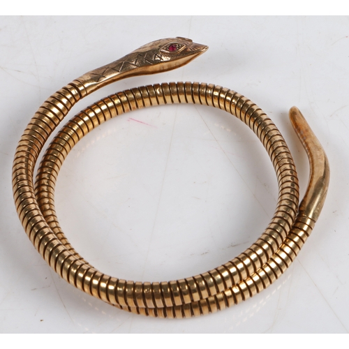 82 - A 9 carat gold and steel spring snake bracelet by Smith & Pepper, the acanthus leaf engraved head wi... 