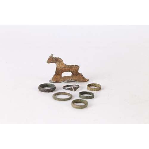 11 - ARTIFACTS. To include six Roman and later rings, also with a lead toy horse, (7)
Found Suffolk.