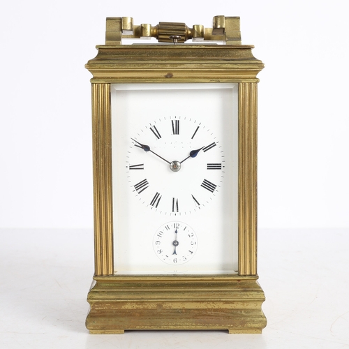 111 - A LATE 19TH CENTURY BRASS CASED REPEATING CARRIAGE CLOCK. A Late 19th century brass cased repeating ... 