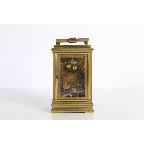 111 - A LATE 19TH CENTURY BRASS CASED REPEATING CARRIAGE CLOCK. A Late 19th century brass cased repeating ... 