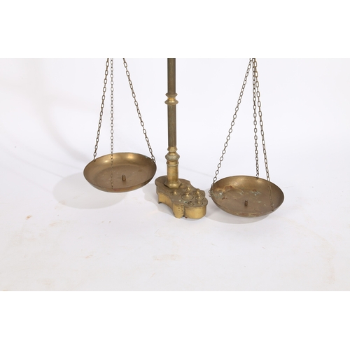 124 - A LARGE PAIR OF 19TH/20TH CENTURY BRASS SCALES. A large pair of 19th/20th century brass scales, the ... 