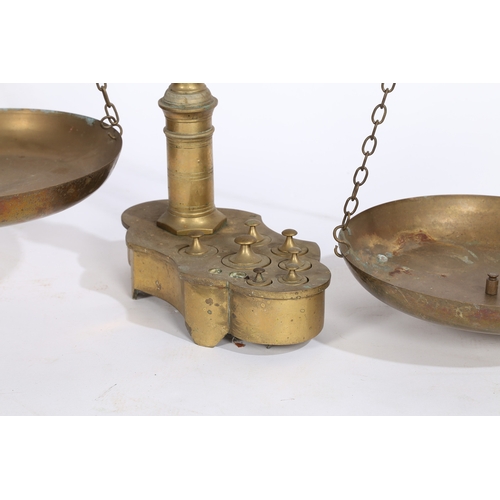 124 - A LARGE PAIR OF 19TH/20TH CENTURY BRASS SCALES. A large pair of 19th/20th century brass scales, the ... 