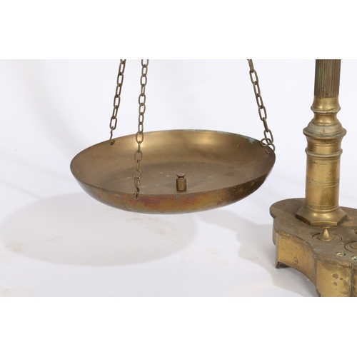 124 - A LARGE PAIR OF 19TH/20TH CENTURY BRASS SCALES. A large pair of 19th/20th century brass scales, the ... 