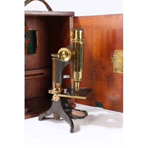 129 - A 19TH CENTURY MICROSCOPE BY BAKER. A 19th century Microscope by Baker, brass and black lacquered ho... 