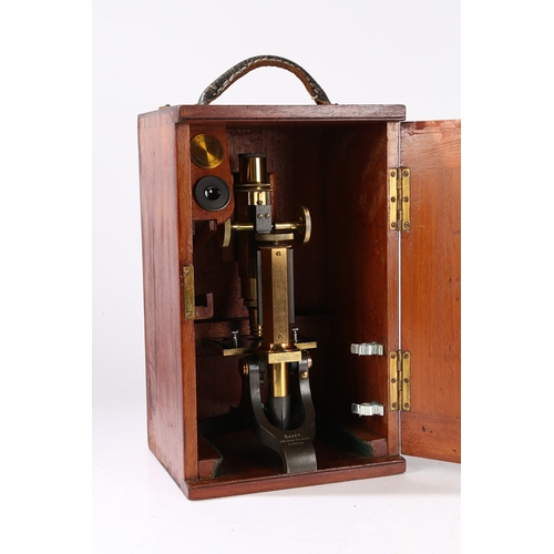 129 - A 19TH CENTURY MICROSCOPE BY BAKER. A 19th century Microscope by Baker, brass and black lacquered ho... 