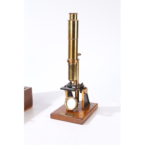 135 - A ROBINSON OF DUBLIN MICROSCOPE. A Robinson of Dublin microscope, brass housed within a fitted case ... 