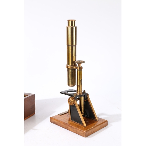 135 - A ROBINSON OF DUBLIN MICROSCOPE. A Robinson of Dublin microscope, brass housed within a fitted case ... 