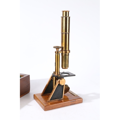 135 - A ROBINSON OF DUBLIN MICROSCOPE. A Robinson of Dublin microscope, brass housed within a fitted case ... 