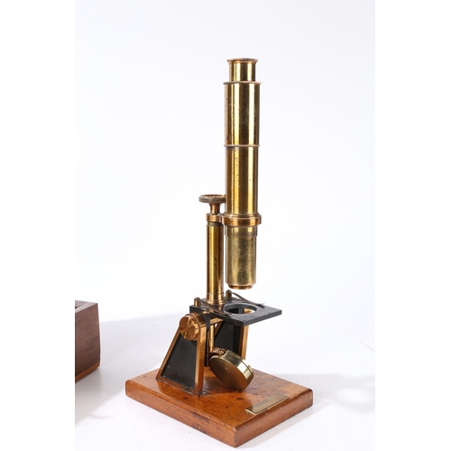 135 - A ROBINSON OF DUBLIN MICROSCOPE. A Robinson of Dublin microscope, brass housed within a fitted case ... 