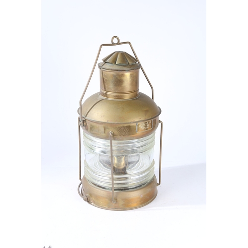 139 - AN EARLY 20TH CENTURY BRASS SHIPS LANTERN. An Early 20th century brass ships lantern, stamped 