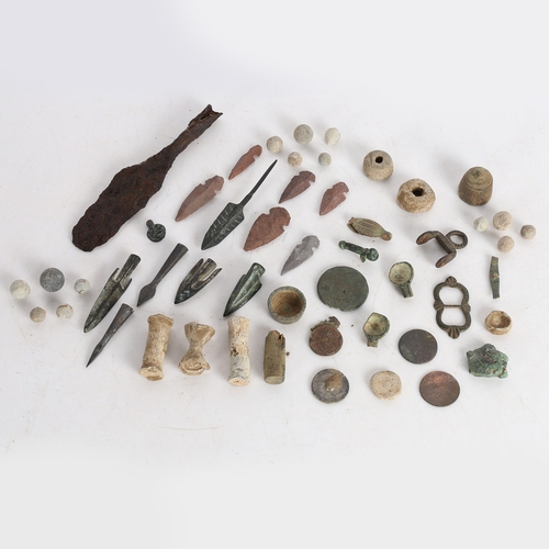 14 - A COLLECTION OF ARTIFACTS. To include bronze Roman arrow heads, (some not period) a phallic pendant,... 