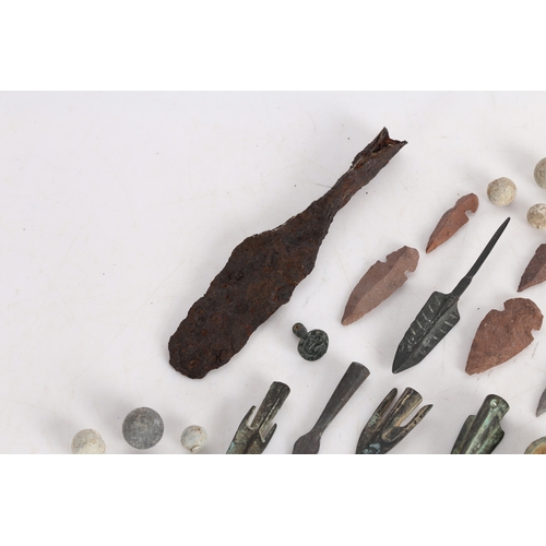 14 - A COLLECTION OF ARTIFACTS. To include bronze Roman arrow heads, (some not period) a phallic pendant,... 