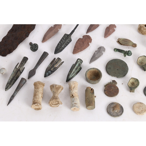 14 - A COLLECTION OF ARTIFACTS. To include bronze Roman arrow heads, (some not period) a phallic pendant,... 