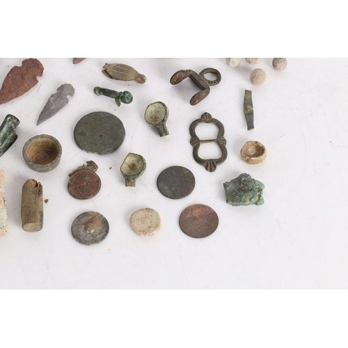 14 - A COLLECTION OF ARTIFACTS. To include bronze Roman arrow heads, (some not period) a phallic pendant,... 