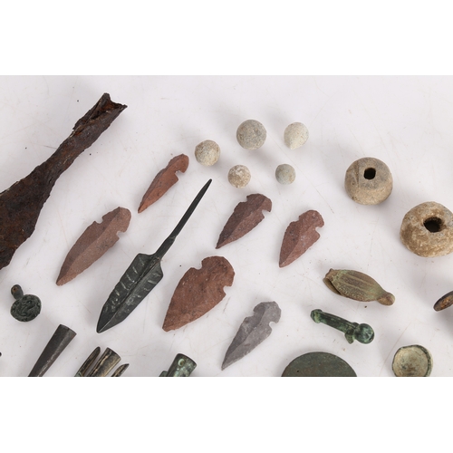 14 - A COLLECTION OF ARTIFACTS. To include bronze Roman arrow heads, (some not period) a phallic pendant,... 