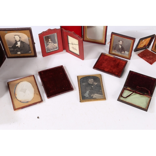 141 - A COLLECTION OF DAGUERREOTYPES AND AMBROTYPES. To include a cased daguerreotype of a seated gentlema... 