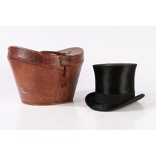 143 - A VICTORIAN MOLESKIN TOP HAT WITH A LEATHER FITTED CASE. A Victorian moleskin top hat with a leather... 