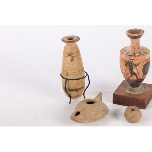 16 - A COLLECTION OF ARTIFACTS. To include two Greek vases 11cm high and 12cm high, a Roman period oil la... 