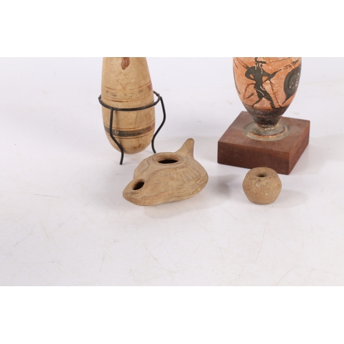 16 - A COLLECTION OF ARTIFACTS. To include two Greek vases 11cm high and 12cm high, a Roman period oil la... 