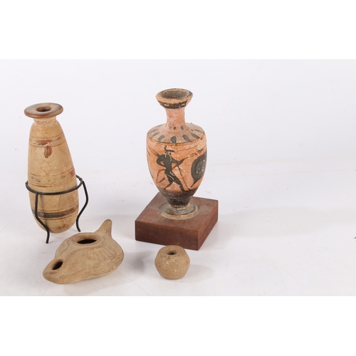 16 - A COLLECTION OF ARTIFACTS. To include two Greek vases 11cm high and 12cm high, a Roman period oil la... 