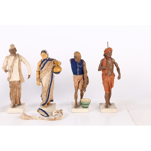 166 - A SET OF SEVEN LATE 19TH/EARLY 20TH CENTURY INDIAN CLAY FIGURES. A set of Seven Indian clay figures,... 