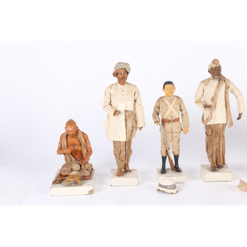 166 - A SET OF SEVEN LATE 19TH/EARLY 20TH CENTURY INDIAN CLAY FIGURES. A set of Seven Indian clay figures,... 