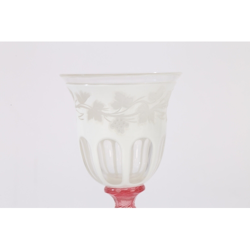 181 - A MID 19TH CENTURY AUSTRIAN BOHEMIAN GLASS GOBLET, CIRCA 1840-50. Having a white overlaid bowl with ... 