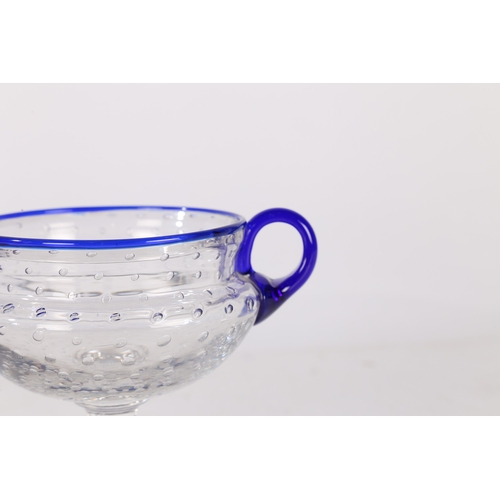 186 - A SAINT LOUIS BUBBLE GLASS BOWL, FRENCH, CIRCA 1926. With blue rim and twin handles, designed by Pau... 