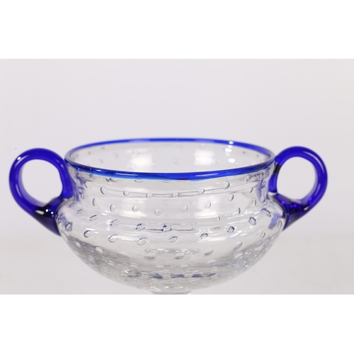 186 - A SAINT LOUIS BUBBLE GLASS BOWL, FRENCH, CIRCA 1926. With blue rim and twin handles, designed by Pau... 