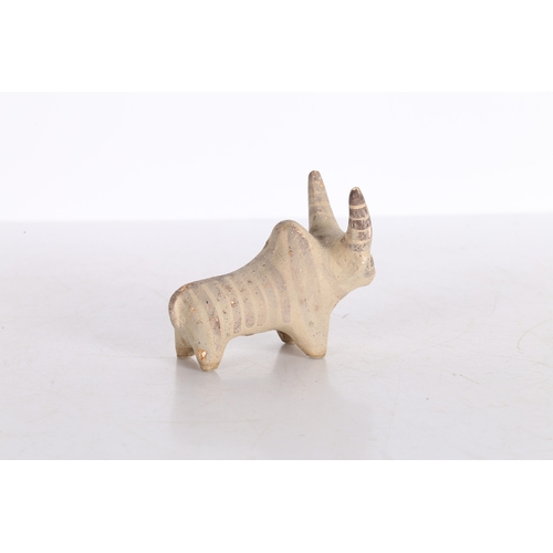 19 - AN INDUS VALLEY TERRACOTTA FIGURINE OF A ZEBU BULL IDOL. An Indus Valley terracotta figurine of a Ze... 