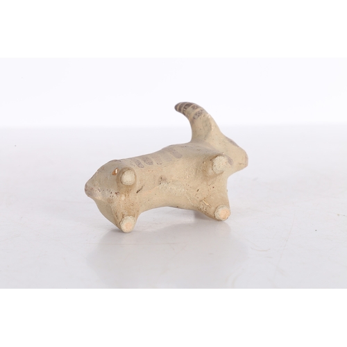 19 - AN INDUS VALLEY TERRACOTTA FIGURINE OF A ZEBU BULL IDOL. An Indus Valley terracotta figurine of a Ze... 