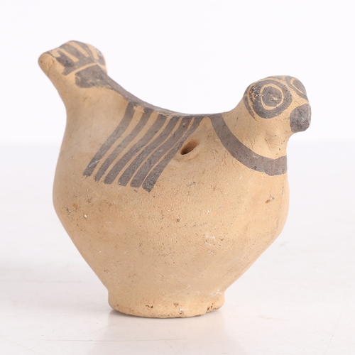 20 - AN INDUS VALLEY TERRACOTTA BIRD IDOL. An Indus Valley terracotta Bird idol, 2000-1300 BCE, having a ... 