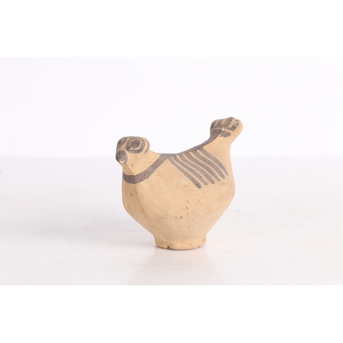 20 - AN INDUS VALLEY TERRACOTTA BIRD IDOL. An Indus Valley terracotta Bird idol, 2000-1300 BCE, having a ... 