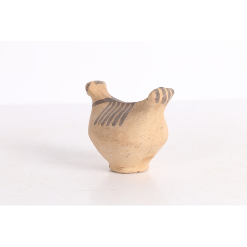 20 - AN INDUS VALLEY TERRACOTTA BIRD IDOL. An Indus Valley terracotta Bird idol, 2000-1300 BCE, having a ... 