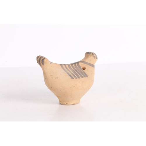 20 - AN INDUS VALLEY TERRACOTTA BIRD IDOL. An Indus Valley terracotta Bird idol, 2000-1300 BCE, having a ... 