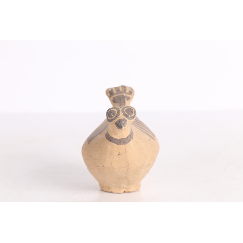 20 - AN INDUS VALLEY TERRACOTTA BIRD IDOL. An Indus Valley terracotta Bird idol, 2000-1300 BCE, having a ... 