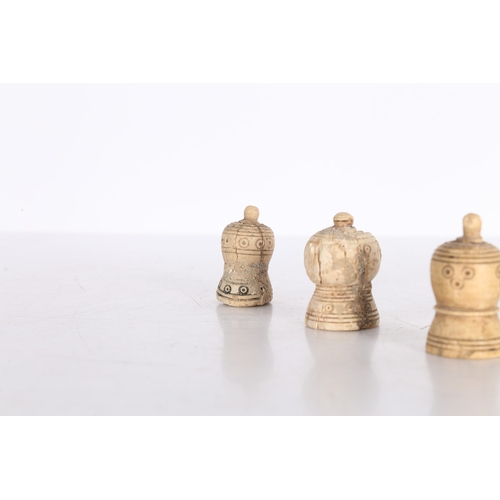 21 - THREE PERSIAN BONE CHESS PIECES, CIRCA 1000-1200 AD. Three Persian bone chess pieces, circa 10th-12t... 