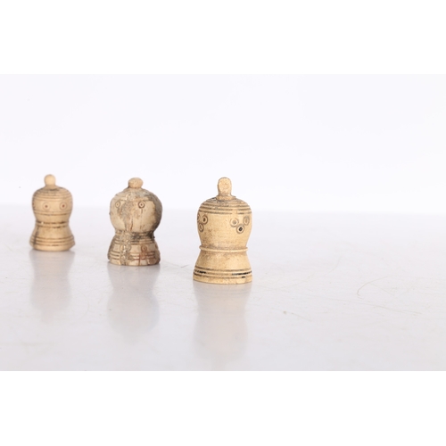 21 - THREE PERSIAN BONE CHESS PIECES, CIRCA 1000-1200 AD. Three Persian bone chess pieces, circa 10th-12t... 