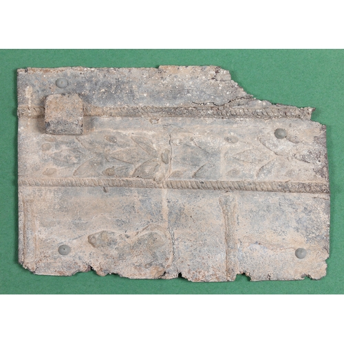 25 - A LEAD PANEL, POSSIBLY ROMAN. With floral and patterns and a lion, mounted to a frame 55cm x 45cm

P... 