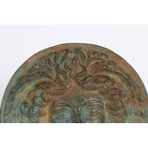 26 - AFTER THE ROMAN A BRONZE PHALERA OF MEDUSA. After the Roman a Bronze Phalera of Medusa, of circular ... 