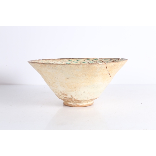 27 - PERSIAN BAMIYAN BOWL SGRAFFIATO 12TH-14TH CENTURY. Decorated with a crossed legged figure to the int... 